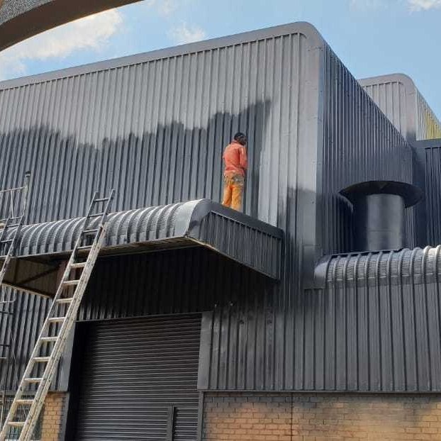 Building cladding cleaned and coated